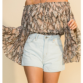 This snake print off shoulder top features bell sleeves and elastic waistband.