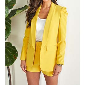 Bubble shoulder long sleeve yellow blazer. Dress to impress at work or dare to wear with jeans and sneakers. Either way you will shine all the way.