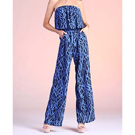 Strapless jumpsuit with deep blue color and branches like print. Elastic lined at neckline and waist, featuring pside pockets.