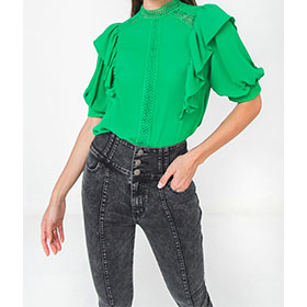 This mock top has a bright green that dresses for any ocassion. Wear it  with a pair of jeans or white pants and you will shine.