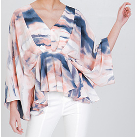 This beatutiful top features kimono slevees V neckline and peplum hemline.