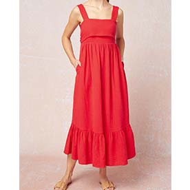 Square neck sleeveless maxi dress featuring self tie closure at back, pockets at sides, fabric overlay at bust and ruffle detail at bottom. 