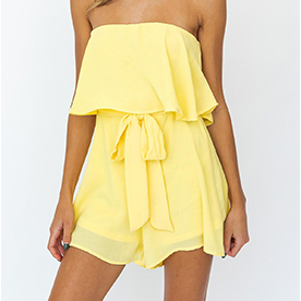 Lemon color solid strapless romper with self tie waist and flounce overlay. The perfert outfit for Spring or Summer 2021.