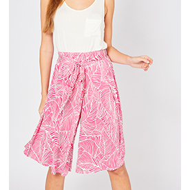 Tropical print high-waist culottes featuring self-tie closure at front. Elasticized waistband. Unlined. 