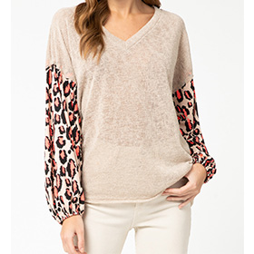 This vneck top features an animal print elasticized bubble sleeve that adds that special detail to maket look different and special. It is semi-sheer and very lightweight.